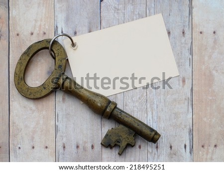 phrase, concept including key using old, antique key and rustic background blank for your own words