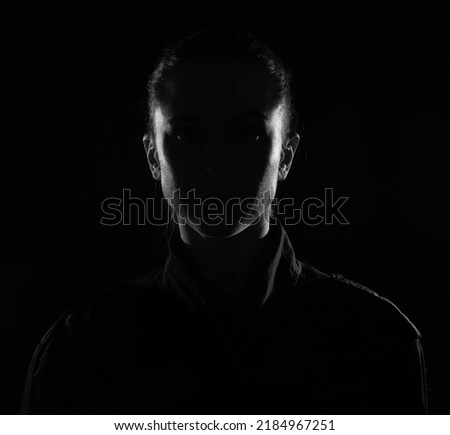 Female person silhouette in the shadow, back lit light Royalty-Free Stock Photo #2184967251