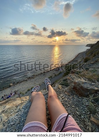 Girl sitting sunset sea beach view 