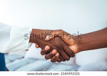 Recruitment manager shakes her hand with male candidate as he gets the job. Businesswoman handshake with a man in office meeting room. Woman interviewer and interviewee shaking hands 