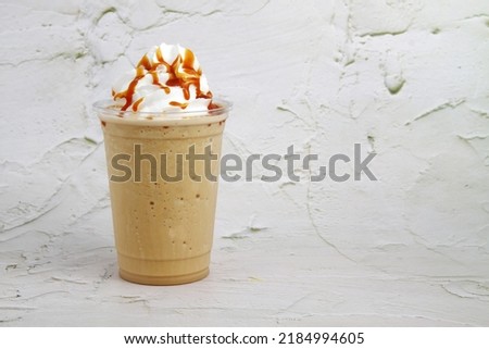 Photo of freshly made caramel macchiato flavored frappe. Royalty-Free Stock Photo #2184994605