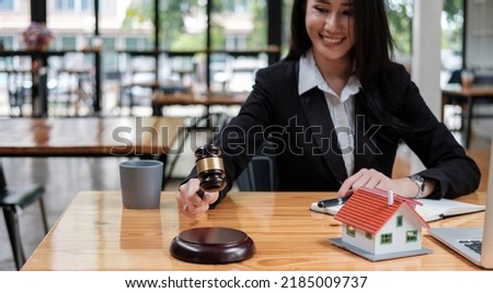 Business woman or lawyers working on wooden desk in office. Law, legal services, advice,Judge auction and real estate concept.
