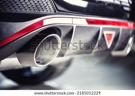 Leaking gases from the exhaust of a petrol or diesel car. Royalty-Free Stock Photo #2185012229