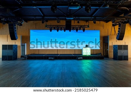 Conference hall with equipment for events. Large monitor, speakers, podium for conferences, events and parties Royalty-Free Stock Photo #2185025479