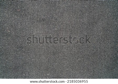 Fabric texture of natural cotton or linen textile material. Black fabric wide background.