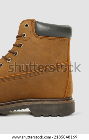 Brown boots on a white background. Winter shoes