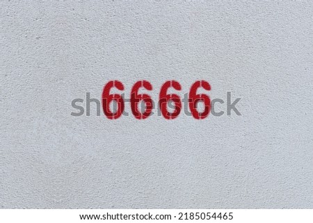 Red Number 6666 on the white wall. Spray paint.
