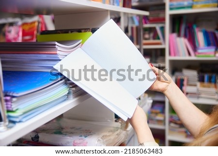 Buying stationery for the new school year Royalty-Free Stock Photo #2185063483