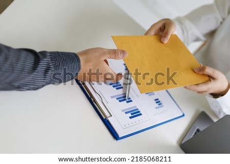Businessman picking up and delivering documents in the office. Royalty-Free Stock Photo #2185068211
