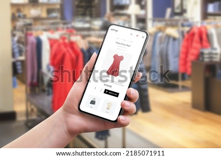 Search for clothes online in a clothing store. Color and size selection on app. Modern e-commerce website on a mobile phone in a woman's hand
