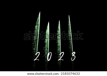 Happy new year 2023 green fireworks rockets new years eve. Luxury firework event sky show turn of the year celebration. Holidays season party time. Premium entertainment nightlife background
