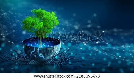 Tree growing on digital plant pot. Eco Technology and Technology Convergence. Green Computing, Green Technology, Green IT, csr, and IT ethics Concept.