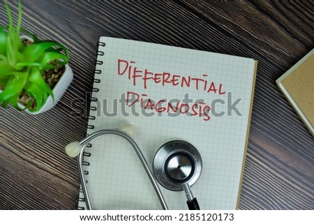 Concept of Different Diagnosis write on a book isolated on Wooden Table. Selective focus on differential diagnosis text Royalty-Free Stock Photo #2185120173