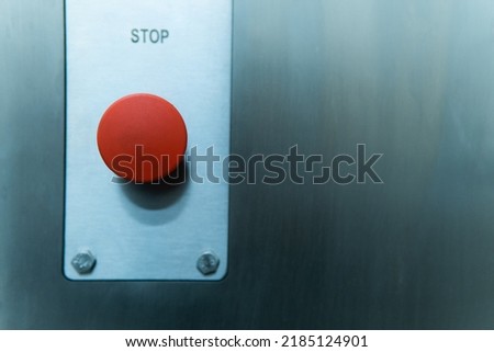 emergency stop button of the machine in production. close-up.