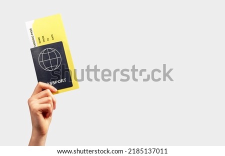 Banner with hand holding passport and boarding pass. Air travel concept. Documents necessary for flying. Place for text High quality photo
