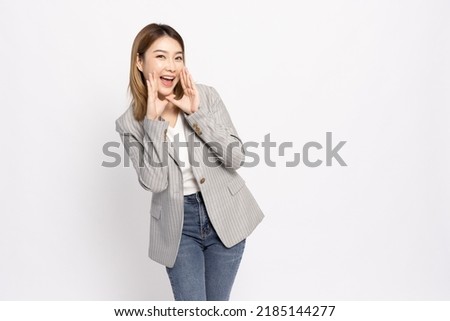 Asian business woman with open mouths raising hands screaming announcement isolated on white background Royalty-Free Stock Photo #2185144277