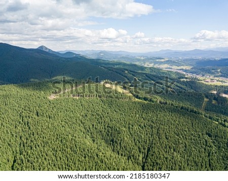 High mountains of the Ukrainian Carpathians in sunny weather. Aerial drone view.