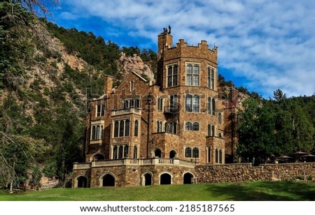 An old castle in the mountains. Mountain mansion. Mansion in mountains. Castle mansion Royalty-Free Stock Photo #2185187565
