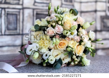 beautiful bridal bouquet lying on a stone table