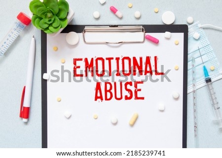 Text caption presenting Emotional Abuse. Business concept person subjecting or exposing another person to behavior Multiple Assorted Collection Office Stationery Photo Placed Over Table