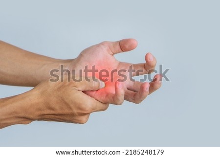 Young man suffering with problem trigger finger.Office syndrome Concept.Health concept.copy space for text. Royalty-Free Stock Photo #2185248179