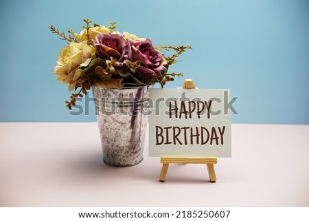 Happy Birthday text message with roses flower on blue and pink background