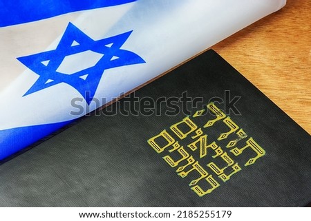 Hebrew Bible - Tanakh and Kippah with Jewish star, Jewish symbols. Jewish religion, Jews and Judaism, Concept. The title of the book means in Hebrew - Torah, Neviim, Ketuvim or abbreviation Tanakh Royalty-Free Stock Photo #2185255179