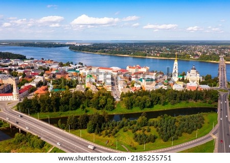 Aerial view of the administrative center of the city of Rybinsk with the Transfiguration Cathedral, as well as the original ..road bridge over the Volga River on a summer day, Russia
