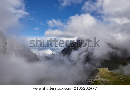 Clouds in mountains - top, bottom, middle. Eastern Sayan. Buryatia Royalty-Free Stock Photo #2185282479
