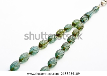 Green and silver beads sequenced, short rosary, tespih tesbih, an important accessory for Turkish culture, isolated on white background