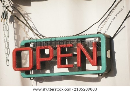 Neon open sign in business window