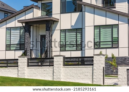 Luxury modern house in Vancouver, Canada. Big luxury house with a patio on sunny summer day. Selective focus, nobody.