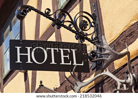 Image of unique old metal hotel sign