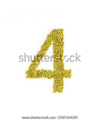 Number 4 made from mung beans. Green mung bean font. Alphabet made from green gram . White background. Dry green maash seeds.
