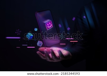 Metaverse and Blockchain Technology Concepts. Person with an Experiences of Metaverse Virtual World via Smart Phone. Futuristic Tone. Hand Levitating Mobile Phone Royalty-Free Stock Photo #2185344593