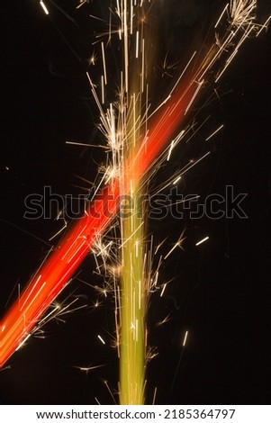abstract red and green flames with sparks close up