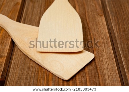 Wooden spatulas for comfortable turning food while cooking.