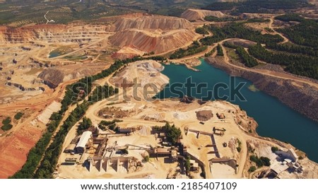 Bird's eye perspective of an open pit mine in Greece. Various workplaces concept. Hard physical work. . High quality photo
