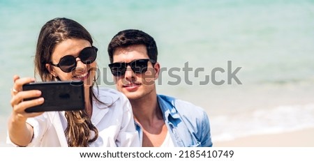 Vacation romantic love young happy smile couple in honeymoon travel holiday trip on sand at blue sky sea beach having fun and relaxing together on tropical beach.Summer travel