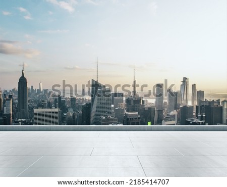 Empty concrete rooftop on the background of a beautiful New York city skyline at daytime, mockup Royalty-Free Stock Photo #2185414707