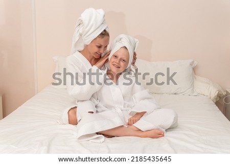 Daughter bath dries smiling mom love thinks elbows smile bed, from girl morning in lifestyle for happy caucasian, little background. Hair health female,