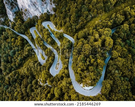 Aerial view of curvy mountain road. Royalty-Free Stock Photo #2185446269