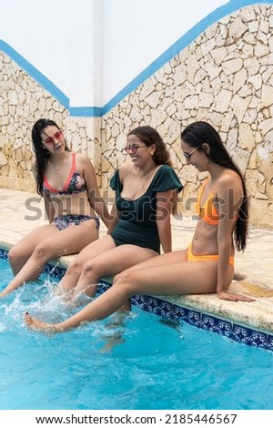Three Friends At Swimming Pool, Enjoying Summer
