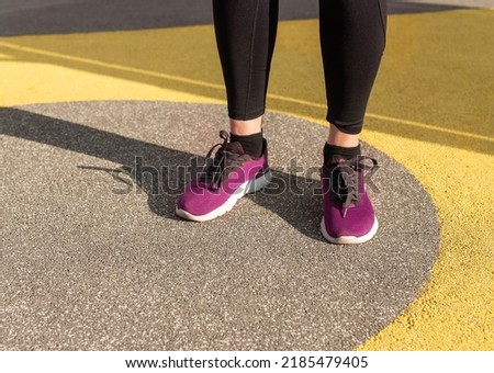Athlete feet in sneakers. Woman doing sport outdoors. Healthy lifestyle, training concept. High quality photo