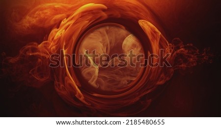 Color water twirl. Fume circle. Ink wave. Astrology eye. Esoteric vision. Orange red golden steam circle vortex on dark creative abstract background.