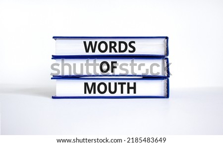 Words of mouth symbol. Concept words Words of mouth on books on a beautiful white table white background. Business, finacial and words of mouth concept. Copy space.