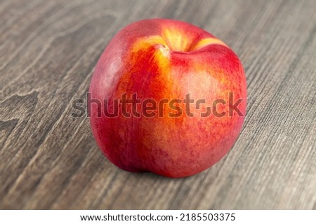 Tasty fresh peach fruit on the desk