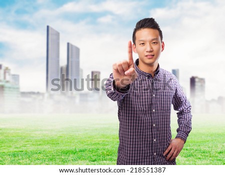 portrait of an asian man doing the one gesture