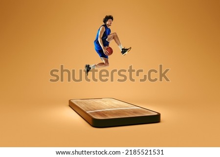 Online broadcasts of sports competitions. Professional basketball player playing basketball on 3d model of device screen over brown background. Show, games, online events, media, betting, ad. Collage Royalty-Free Stock Photo #2185521531