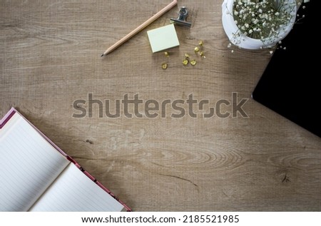 wood work table desk, work table with  note paper,notebook,tablet,clips,pencil,succulent plant top view,Flat lay of Office desk copy space